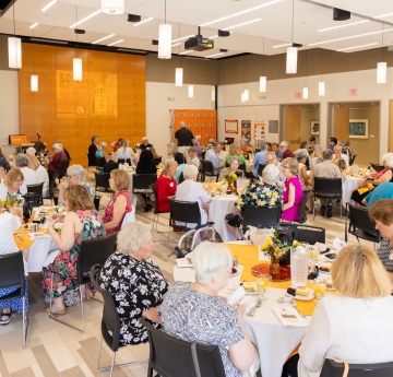 Alumni Center room full of event attendees