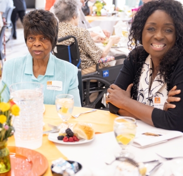 Two event attendees at table
