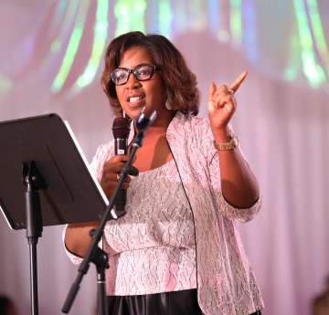Claudine Ewing with microphone