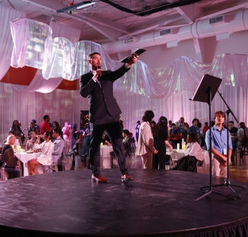 Man on stage with microphone