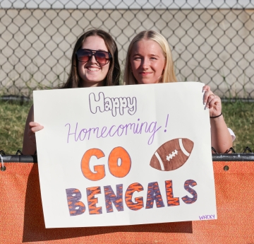Two students with Go Bengals sign