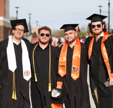 Four graduates
