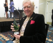 Tom Prestopnik holding an award